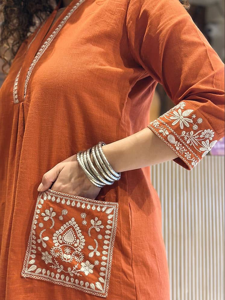 Women's Rust Orange Cotton Kurta Set with Embroidered Pockets & Trousers