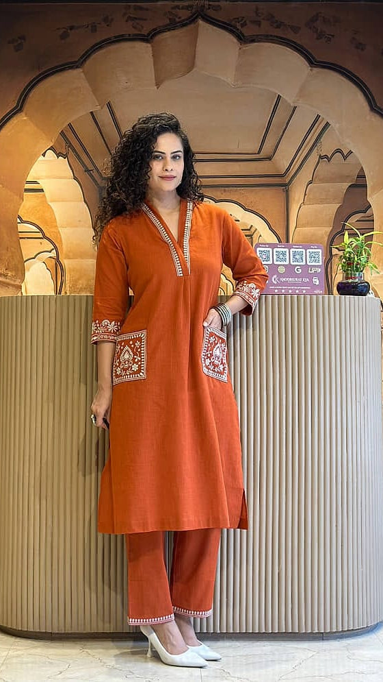Women's Rust Orange Cotton Kurta Set with Embroidered Pockets & Trousers